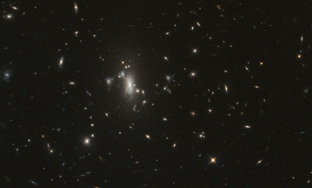 NASA’s Hubble Seeks Lensed Supernova, Marks 200,000 Orbits