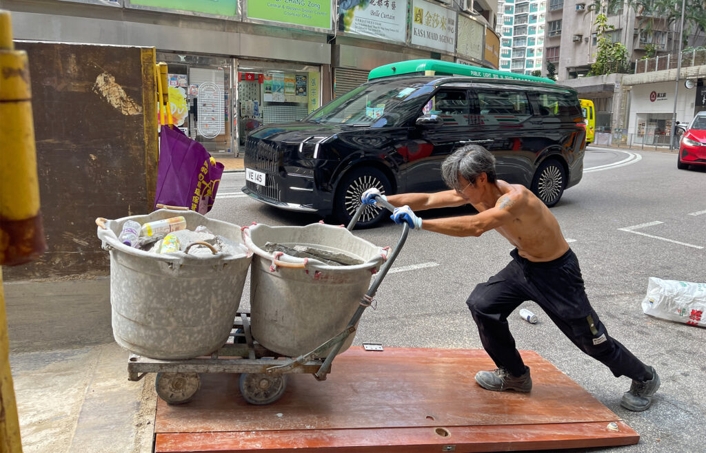 As Hong Kong heats up, calls grow for tougher rules to protect outdoor workers