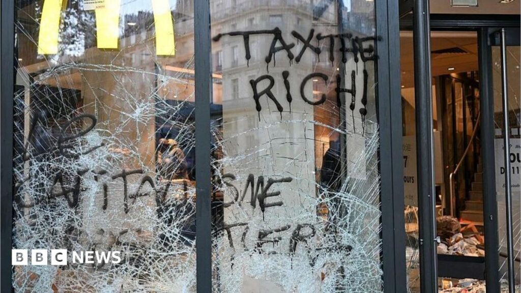 France protests: Burnt out cars and shattered glass on Paris streets after protests turn to riots and looting
